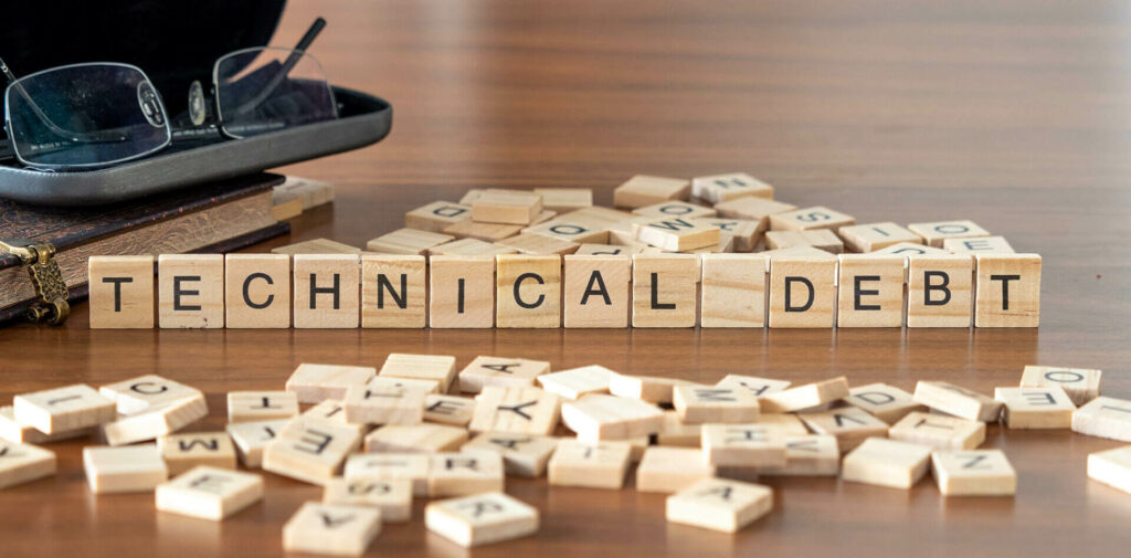 Wooden blocks spelling out the word TECHNICAL DEBT