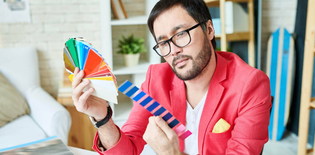 Pensive stylish person choosing new line colors